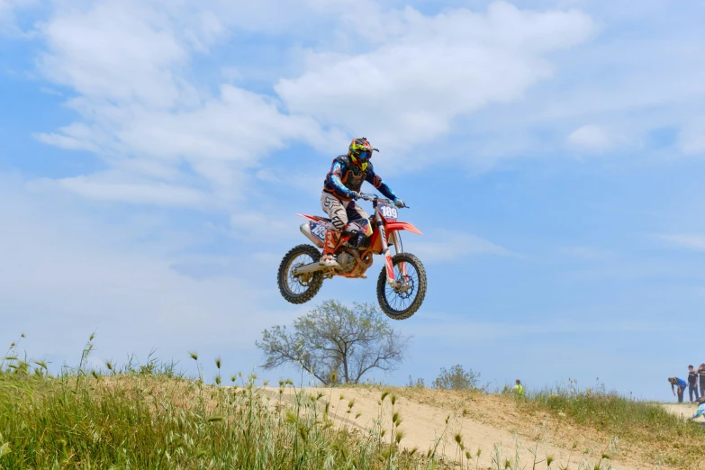 a person is in the air on a dirt bike