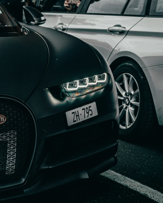 two cars parked side by side on the street