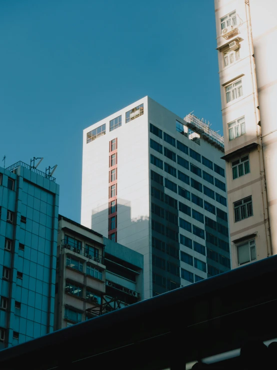 a view of several tall buildings in the city