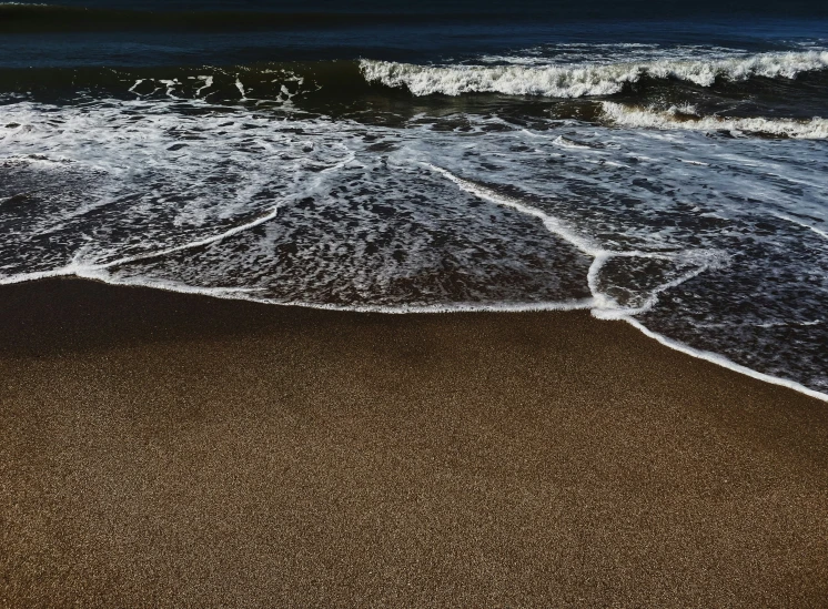 the waves are in a very small stream near the beach