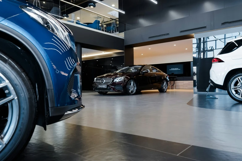 an open garage with two cars parked inside