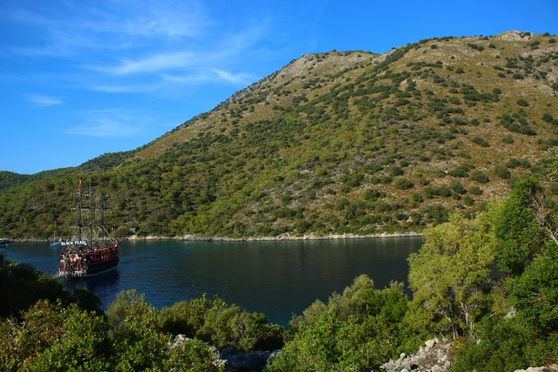 the boats are on the water near the shore