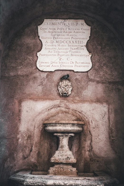 the old fountain is standing in a stone cave