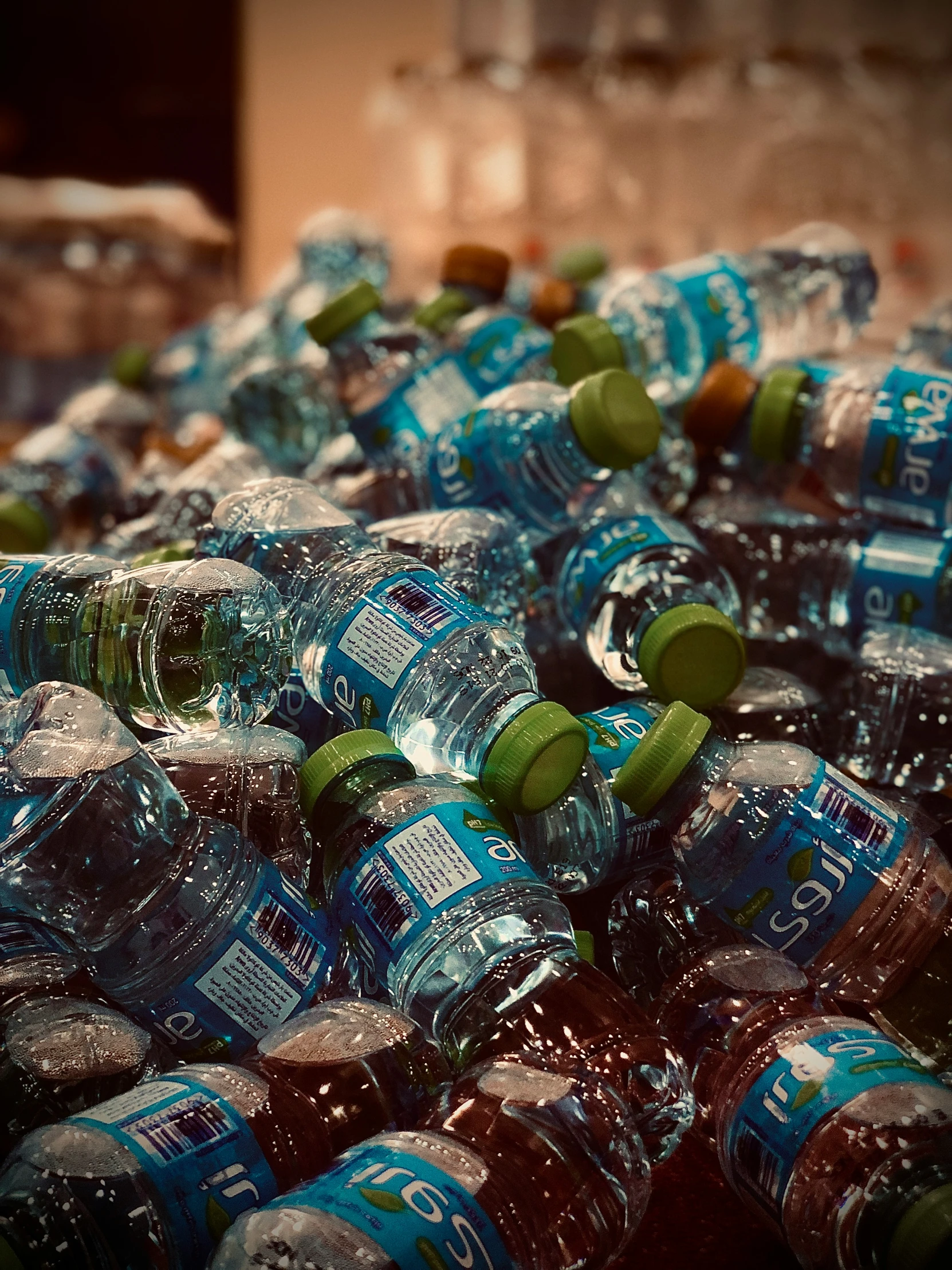 an array of empty bottles are stacked on top of each other