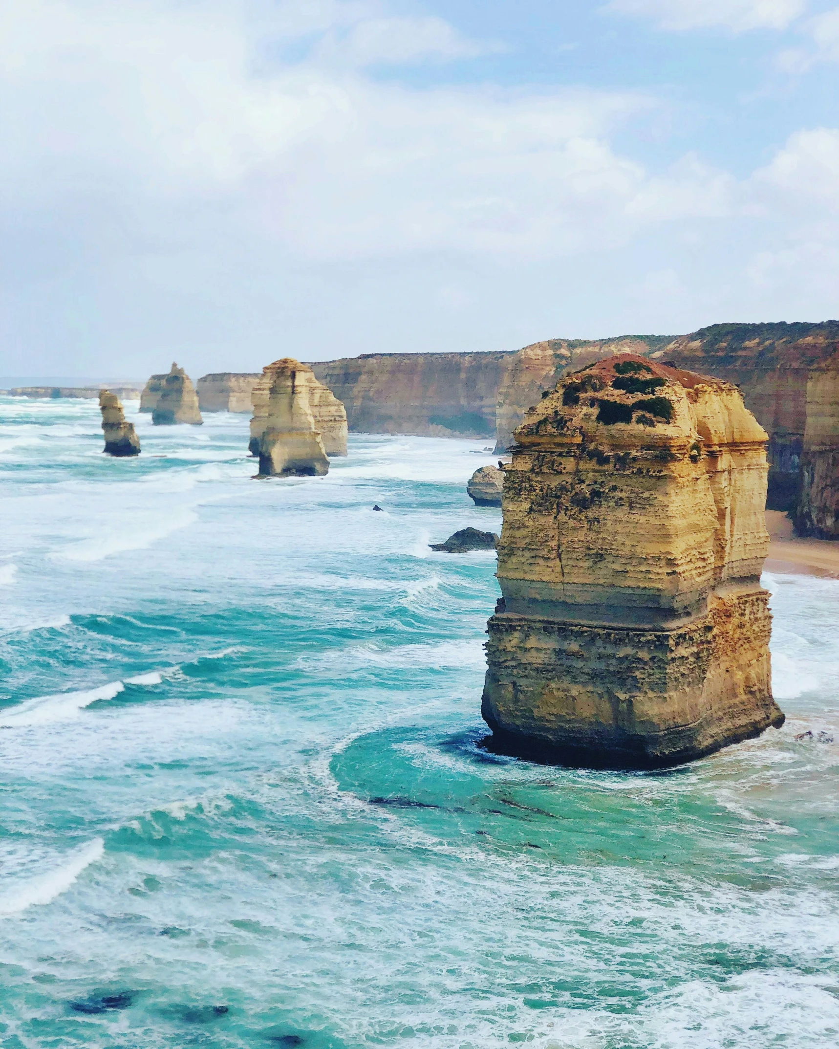 rock formations and rocky shoreline with rolling water