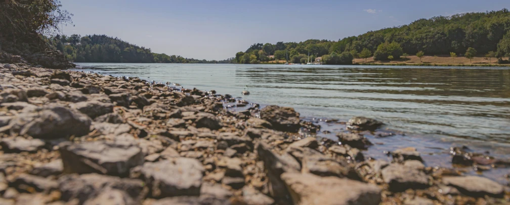 water and rocks along the shore of a river