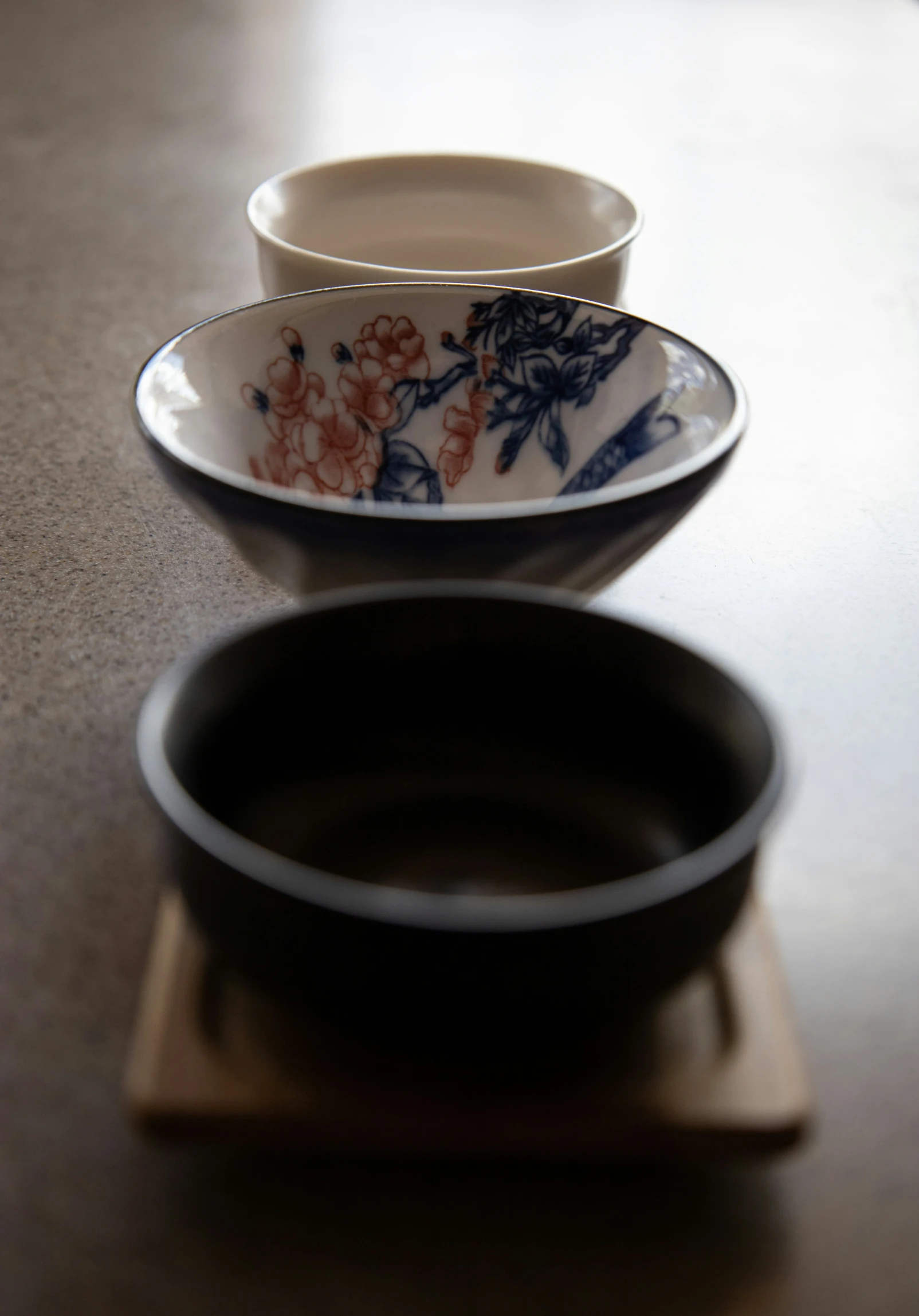 a plate with a bowl near it sitting on top of a table