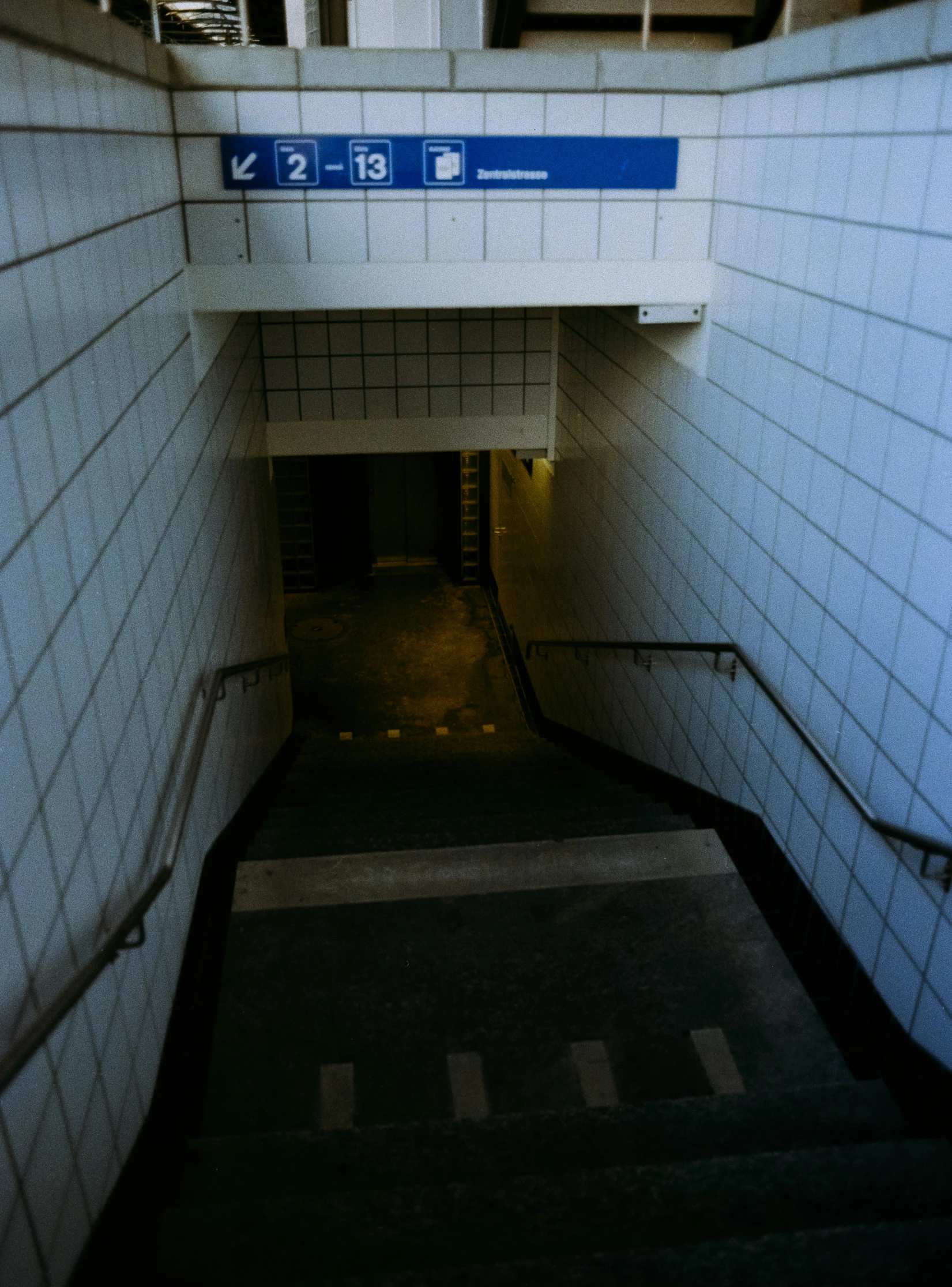 stairs and signs at the top of the stairs