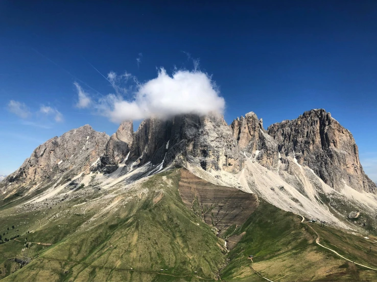 a very tall mountain towering over the mountains