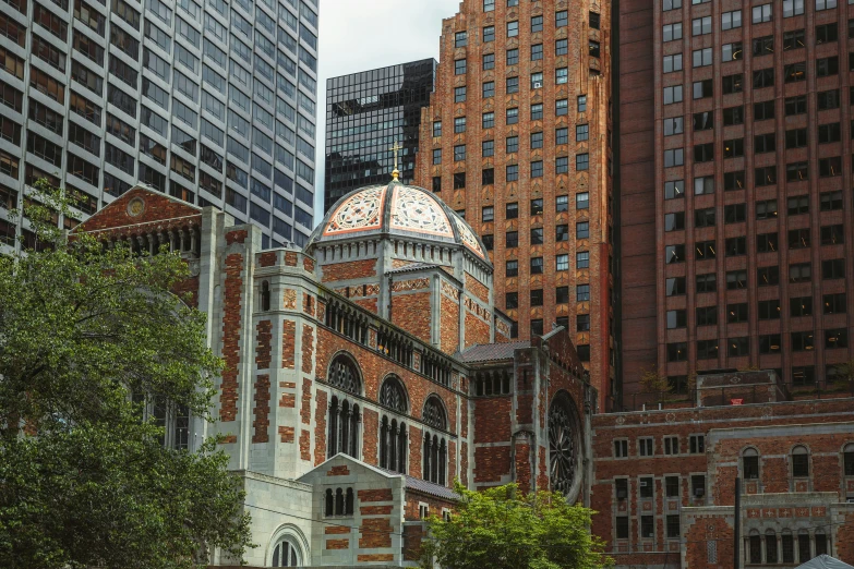 the view of a beautiful brick building in a city