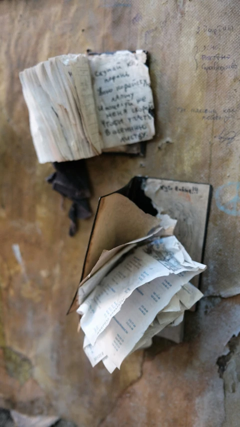 an open book lying on top of a wooden table