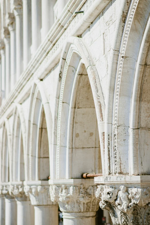 an ornate and old building has very long columns