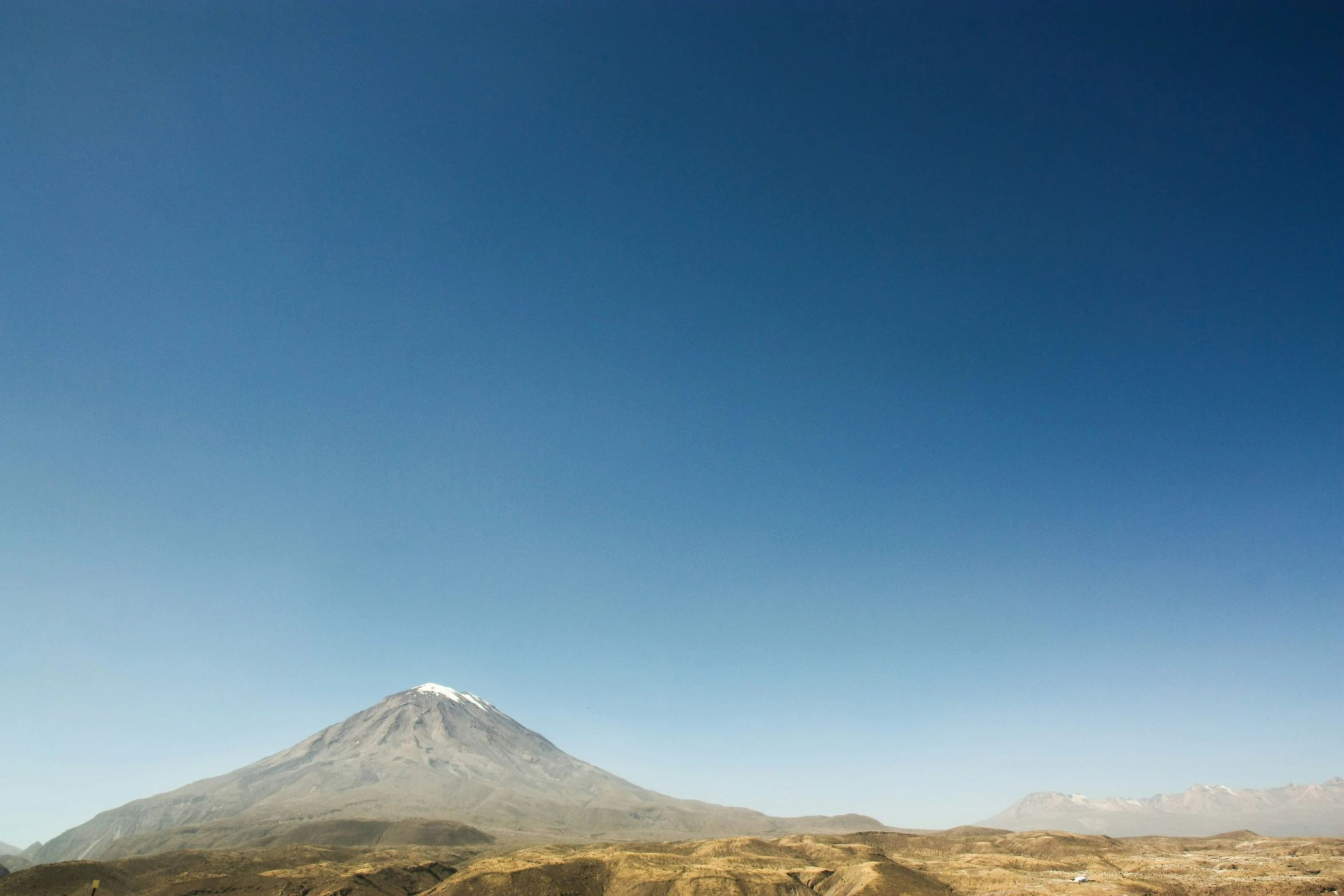 a view of a very tall white mountain in the sky