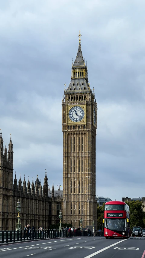 big ben towering over a city street and bus