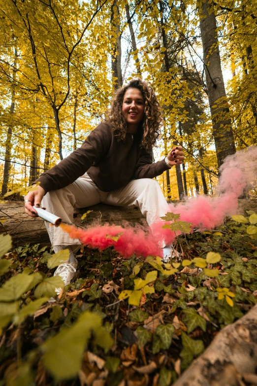 a woman is posing for a po in the woods with her pipe