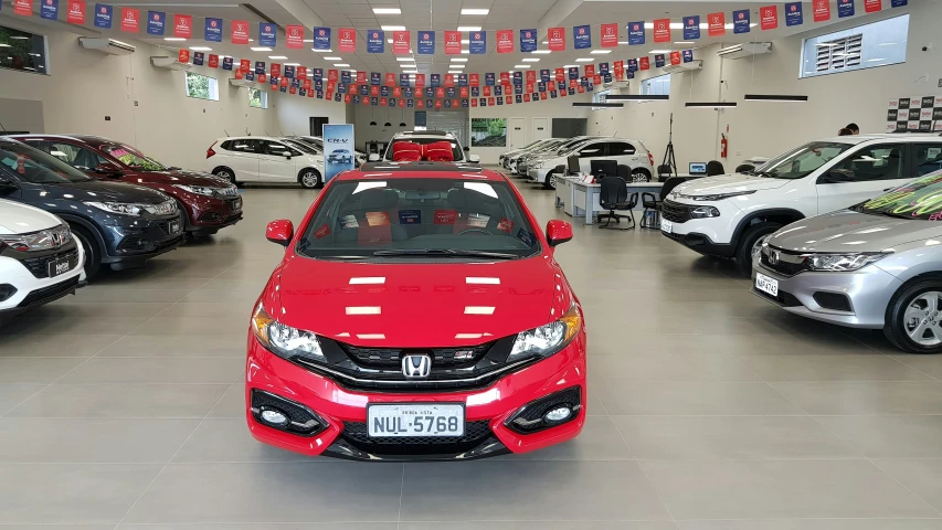 a garage with cars in the showroom during the day