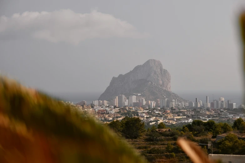 the mountain sits on a hilltop overlooking the city