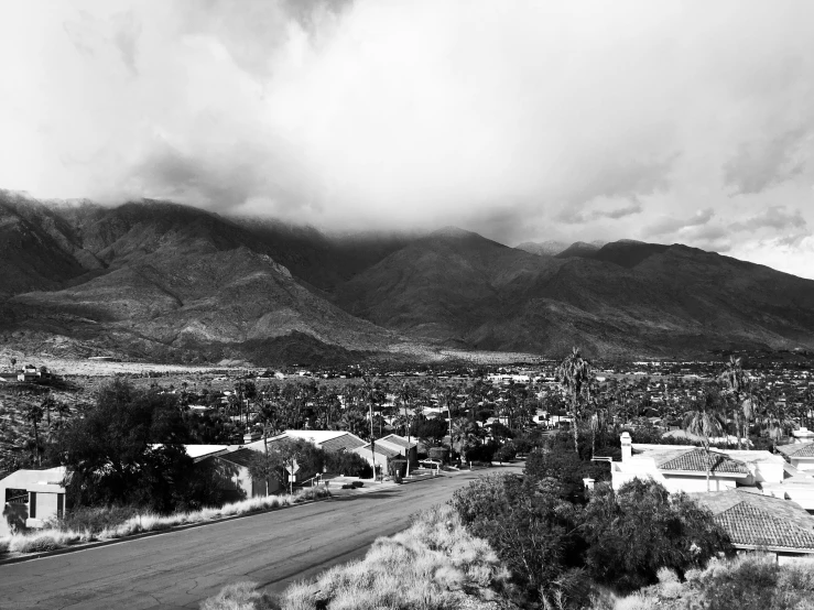 the sky is filled with storm clouds above a small town