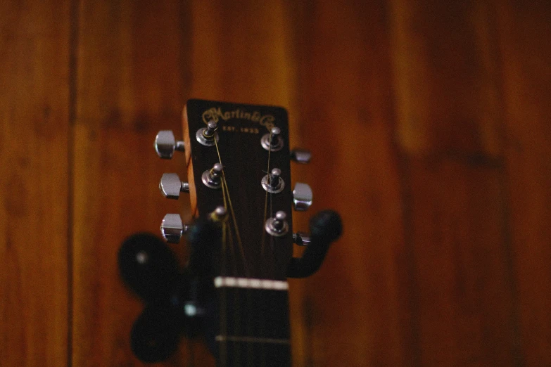 a close up view of a guitar's heads and strings