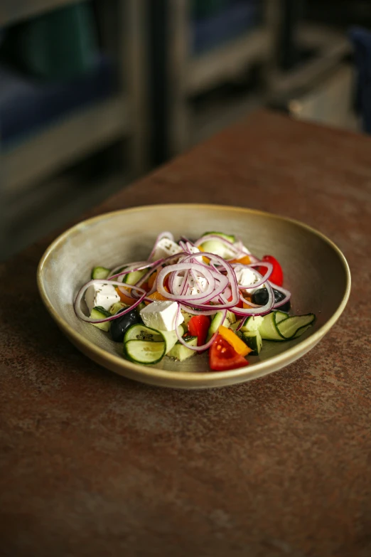 a close up of a bowl of food on a table