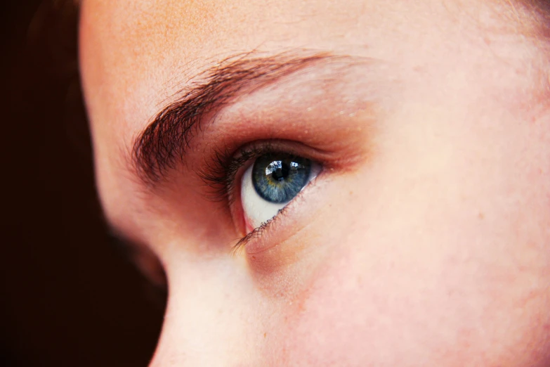 an eye s of a woman with blue eyes