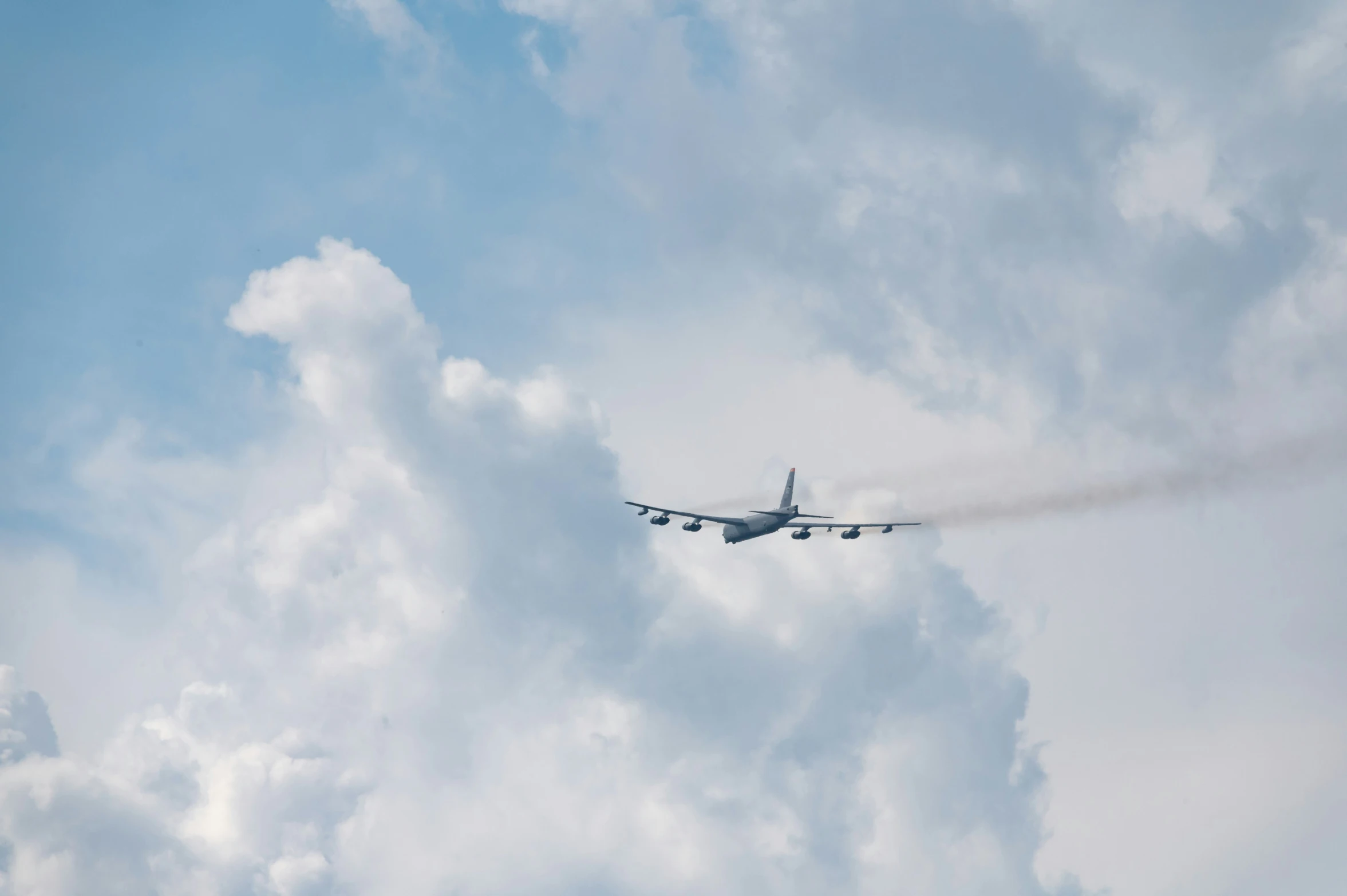 an airplane with smoke emitting out of its nose