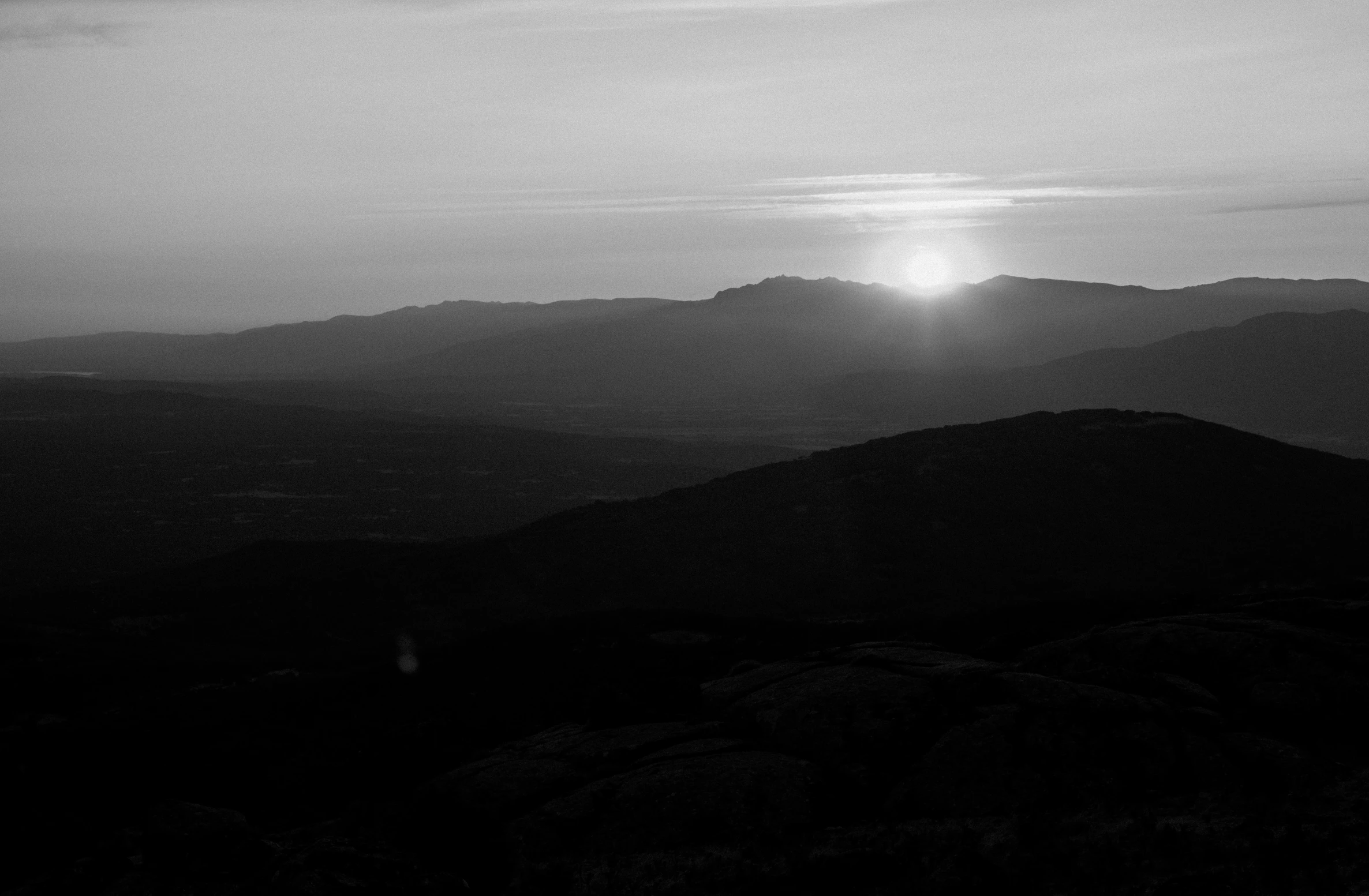 mountains and hills as the sun rises