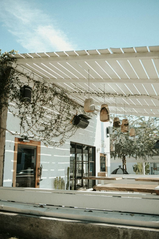 a restaurant with a white and beige ceiling