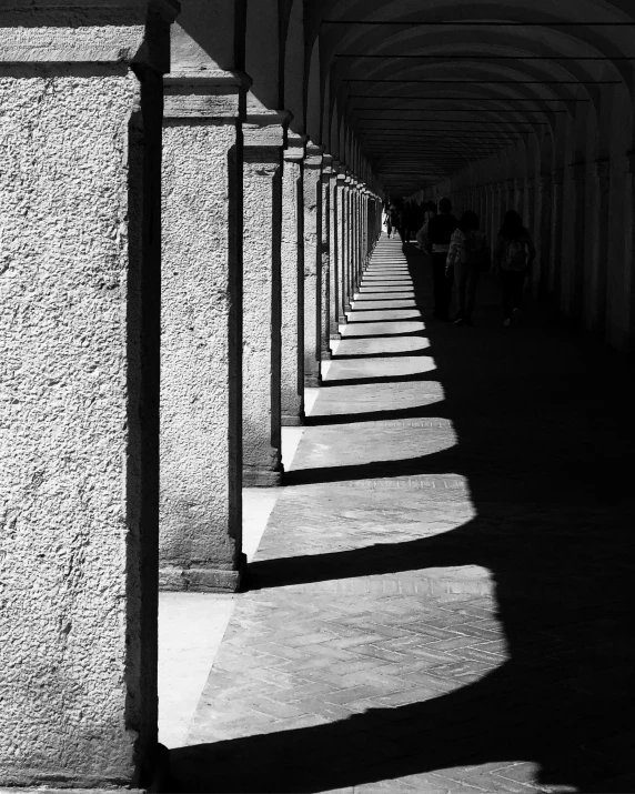 long shadows line the building with long pillars