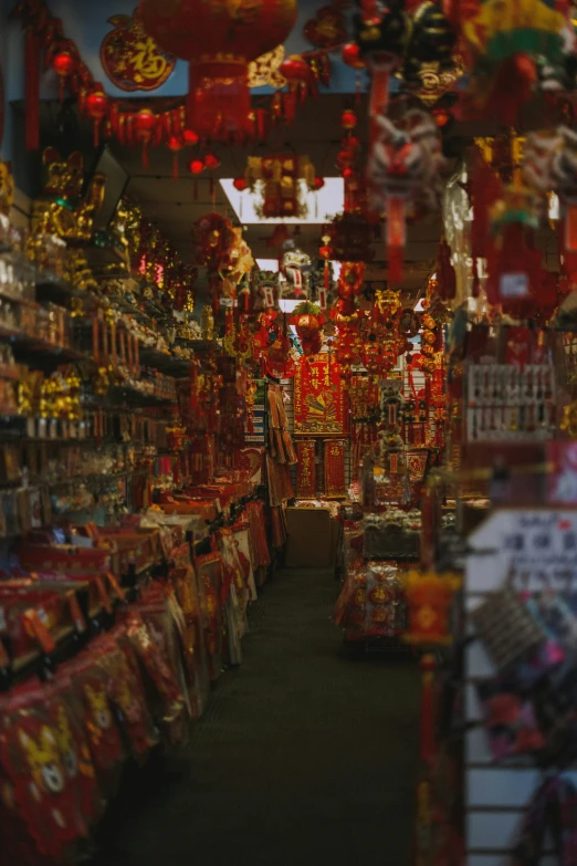 shoppers walk through a brightly lit holiday display