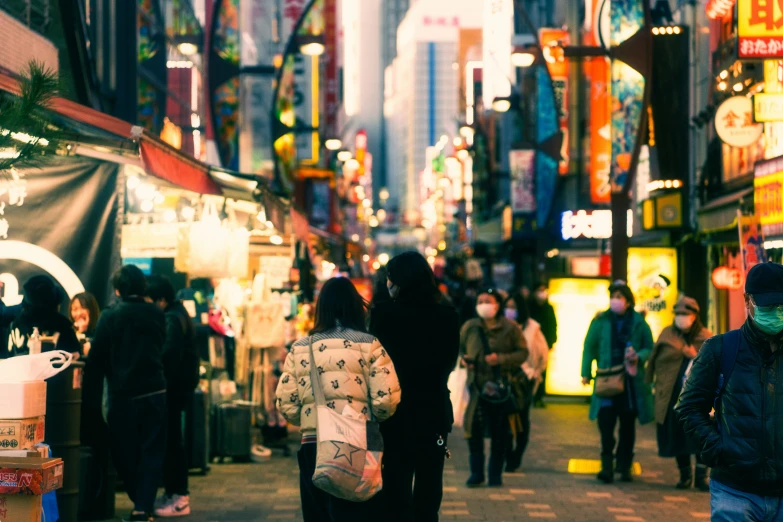 people walking on an alley in a city