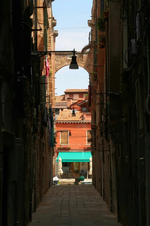 an arched alley way in an old city