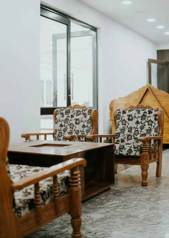 a couple of old fashioned chairs in a room