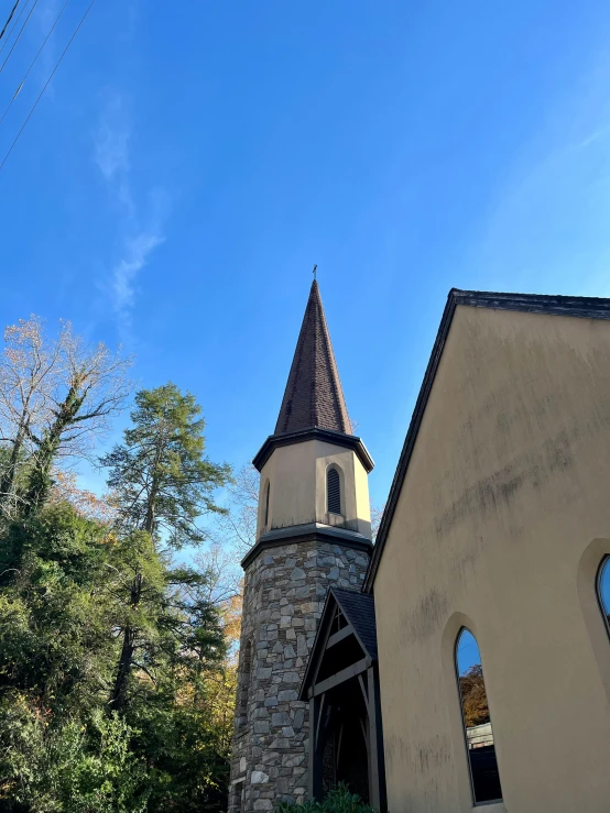 an old church with a tower and arched windows