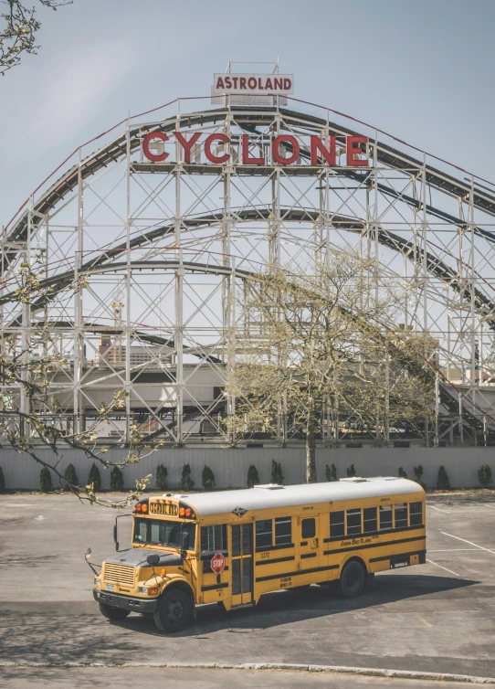 an empty school bus sits in front of a ride - along