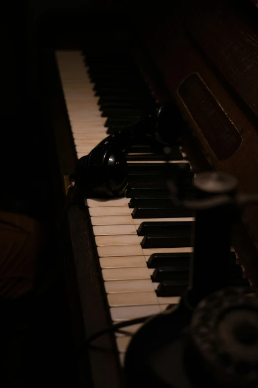 a person in a dark room playing an organ