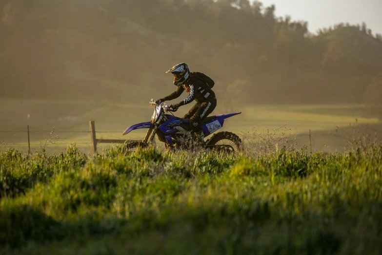 there is a man riding on a dirt bike