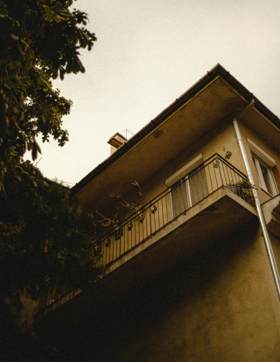 a white clock sitting next to a building