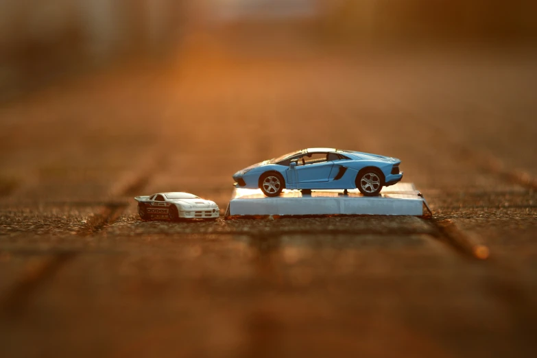 a car and an empty box sitting on the ground