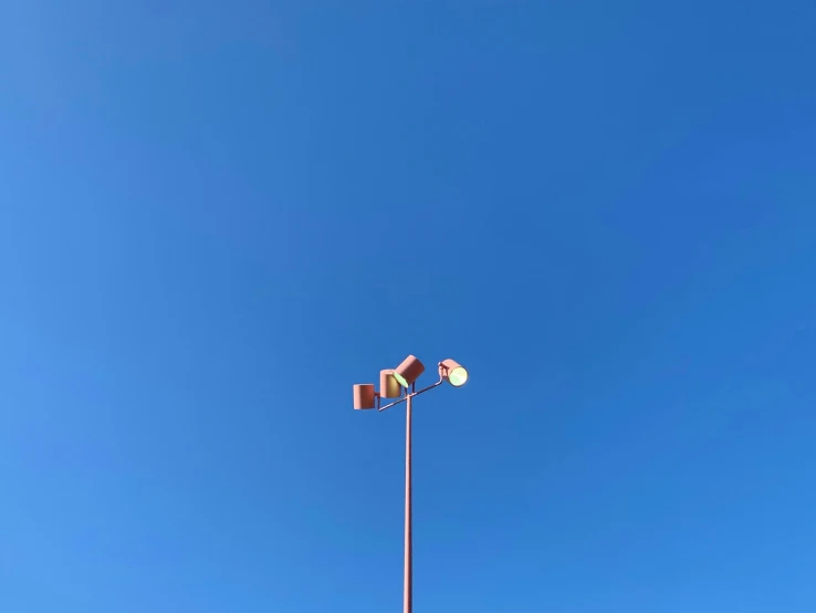 the traffic light is next to a parking lot