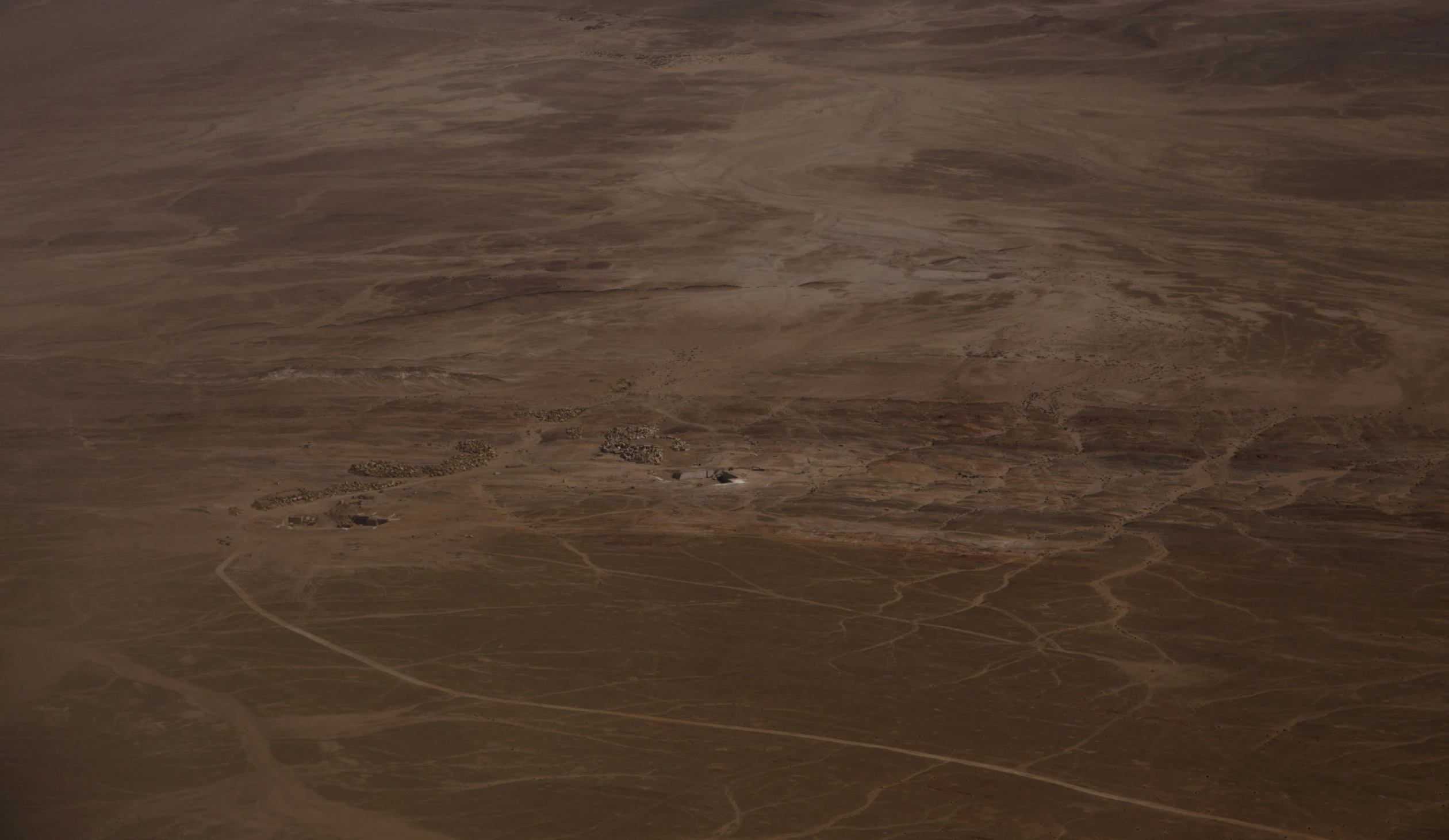 some rocks and dirt in the desert