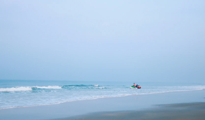 a man riding on top of a white surfboard