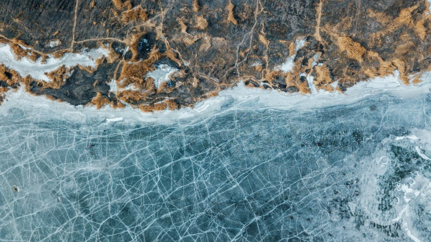 a aerial view of ice floating on top of a body of water