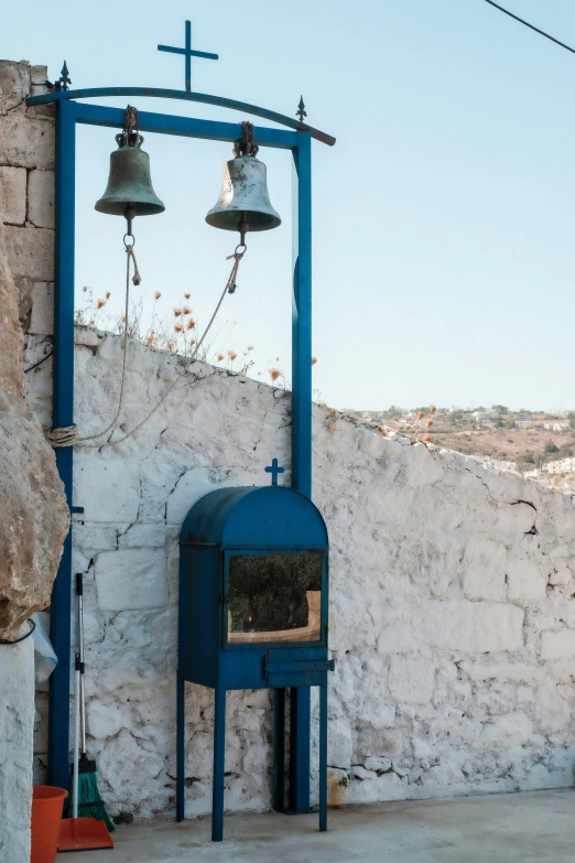 a couple of bells that are on a building