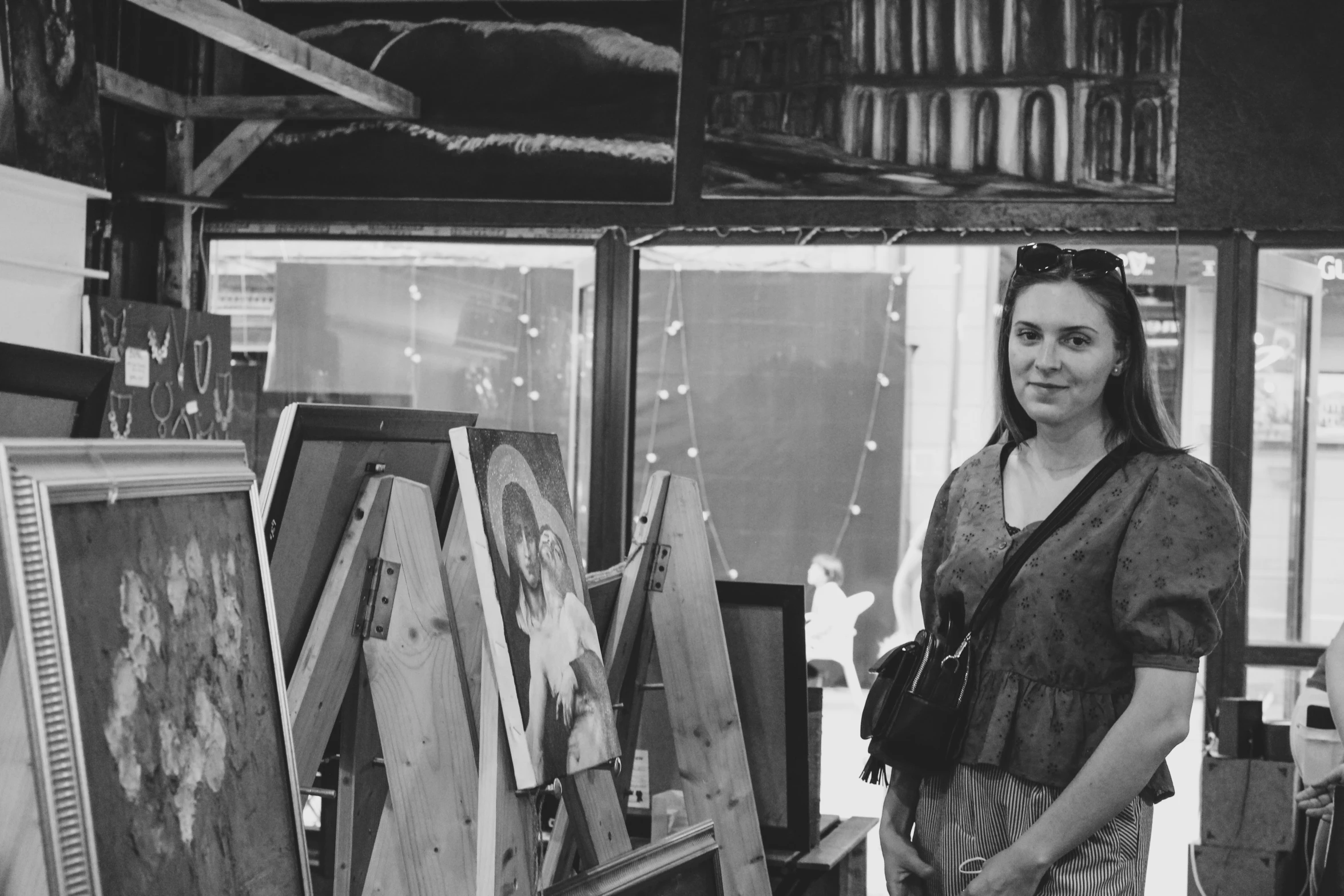 a black and white po of a woman with her picture of a painting