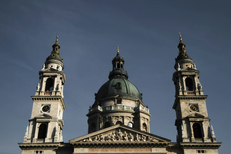 an old building with tall towers and a clock