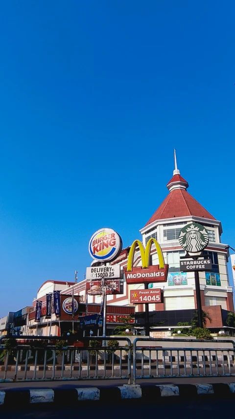 a clock tower in front of an amut center