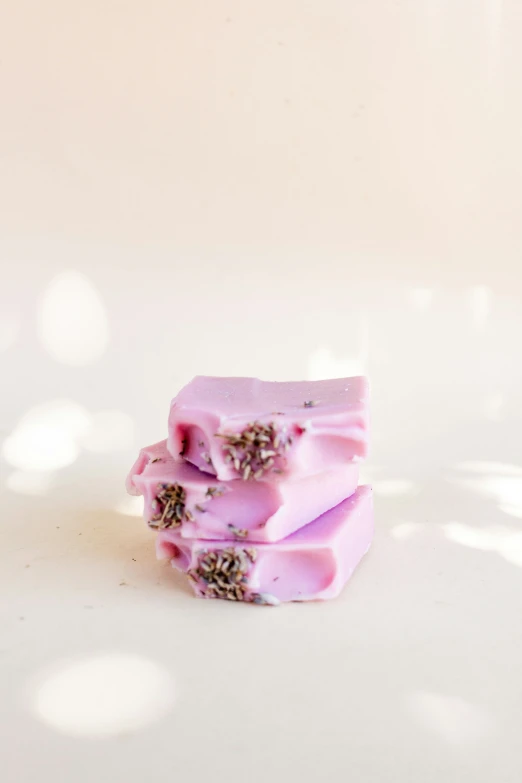 some soap bars sitting on top of a white table