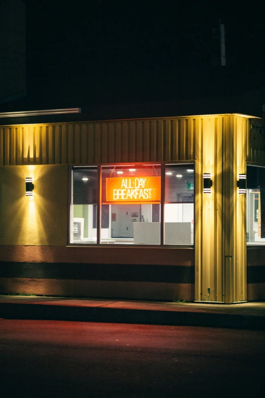 a fast food store with neon lights outside