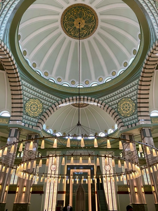 a view inside a building looking at the ceiling and dome